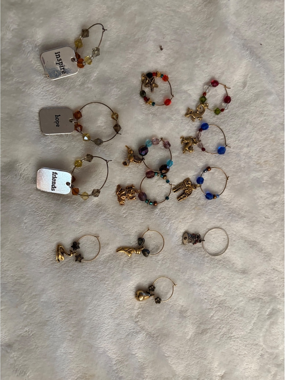 Various wine glass charms 3 small sets - 13 total